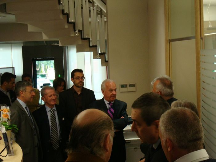 Il presidente Antonio Viglione all'inaugurazione dei locali cuneesi della BCC Pianfei. Nelle altre foto l'esterno e l'interno della nuova sede