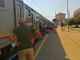 I passeggeri del treno per Ventimiglia fermo nei pressi della stazione di Trofarello