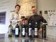Irene e papà Dario con le sei etichette di vino prodotte dalla loro azienda &quot;Bricco del Cucù&quot;