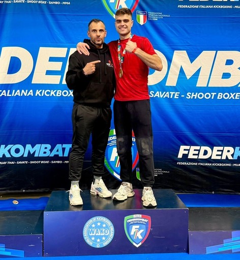 Andrea Alladio con l'allenatore Simone Concu