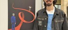 Marco di Molfetta con il manifesto esposto a Milano nella mostra "Continuiamo a fare rumore" dedicato a Giulia Cecchettin