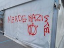 Una delle scritte apparse all'hub vaccinale del Movicentro di Cuneo